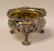 A HEAVY QUALITY SILVER & SILVER-GILT FOOTED SALT of circular form and raised on three scroll-feet,