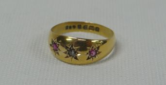 18ct GOLD BAND RING SET WITH SINGLE DIAMOND AND TWO RUBIES, 3.6gms
