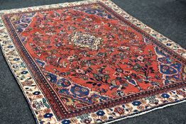 A PERSIAN SAROUK VILLAGE RUG in medallion design, 290 x 190 cms