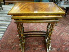 A set of three mahogany side tables with rectangular tops, block and turned supports and bowed bar