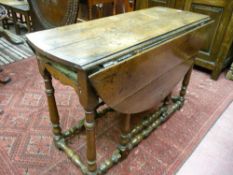 An 18th Century and later oak gate leg dining table with single end drawer front (drawer missing) on