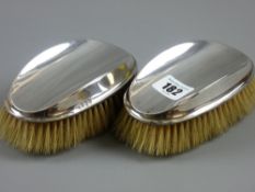 A pair of Birmingham silver gentleman's clothes brushes
