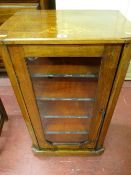 A Victorian inlaid walnut single glazed door music sheet cabinet, 88.5 cms high, 51 cms wide, 34.5