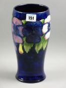 A MOORCROFT PANSY VASE, a 24 cms vase patterned on a cobalt blue ground, impressed to the base 'W