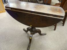 AN EARLY OAK TWIN FLAP TRIPOD TABLE on a turned column base, 70 cms high, 80 cms wide