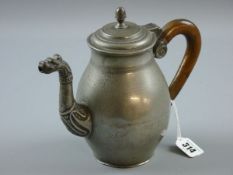 A PEWTER WINE JUG, a continental wine jug of bulbous form with stepped lid and acorn knop,