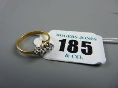 AN EIGHTEEN CARAT GOLD THREE STONE DIAMOND CROSSOVER RING of three floral cut small diamonds, 2.4