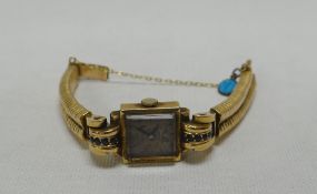 A BELIEVED GOLD-PLATED LADIES WRISTWATCH 'RIX, PARIS' with associated snake-style bracelet and