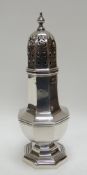 A SILVER BEEHIVE CASTER on an octagonal base, Birmingham 1921, 4.1ozs
