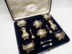 A CASED SILVER EIGHT-PIECE CRUET SET, London 1913, 11.3ozs total (approx)