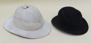 A CHRISTY'S LONDON BOWLER HAT & A COLONIAL PITH HELMET Provenance: The Estate of Thomas Ifor Rees,