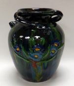 A WILLIAM FISHLEY HOLLAND STUDIO POTTERY mottled green and dark glazed slipware vessel with three