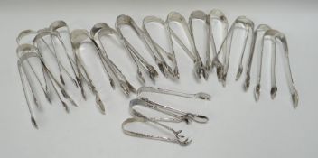 A COLLECTION OF TWENTY-THREE SILVER SUGAR TONGS, 22ozs