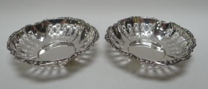 A PAIR OF DELICATE SILVER BON-BON BASKETS of lobed circular form, 2.7ozs