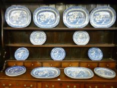 A WILLOW PATTERN DRESSER SET of six meat platters and fourteen dinner plates