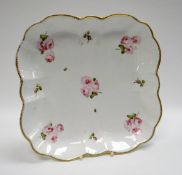 A SWANSEA PORCELAIN SQUARE DISH of rounded and fluted form with gilded rim and painted with pink
