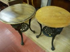 TWO VICTORIAN CAST IRON TAVERN TABLES by Gaskell & Chambers Ltd, Bar Fitters, circular wooden tops