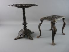 TWO VICTORIAN CAST IRON STANDS, a circular topped example with heart and floral top on a column