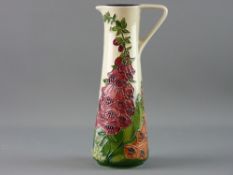 A MOORCROFT 'AMBER WOOD' JUG, 24 cms high, designed by Rachel Bishop, tune line foxglove
