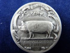 A NATIONAL PIG BREEDER'S MEDAL designed by H Maryon, awarded at the Royal Welsh Show, 1930 to Lord