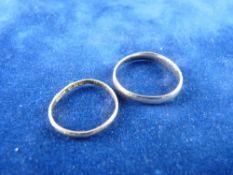 TWO WEDDING BANDS, a narrow twenty two carat gold ring, 2 grms and a wider nine carat gold ring, 1.6
