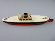 AN ARNOLD TINPLATE CLOCKWORK LINER, a shallow hole single funnel toy in red, black and cream with