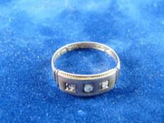 A FIFTEEN CARAT GOLD DRESS RING with three tiny czs, 1.7 grms total