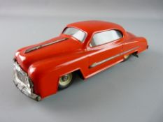 A RED TINPLATE SALOON CAR, clockwork driven, marked M510 on the front number plate, the base