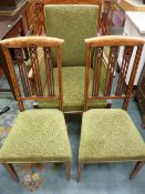 AN EDWARDIAN INLAID MAHOGANY SALON ARMCHAIR AND FOUR HIGH BACKED SIDE CHAIRS, matching inlay and