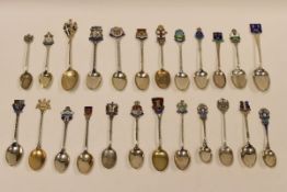 A COLLECTION OF TWENTY-FOUR SILVER SOUVENIR SPOONS for British and Irish resorts, all but three with