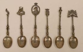 A SET OF SIX DUTCH SILVER SPOONS each with twist stems and engraved heraldic bowls inscribed with