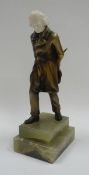 A BRONZE & IVORY FIGURE OF A STRIDING GENT, PROBABLY BY JOSEF LORENZL on a stepped green onyx