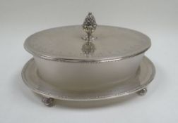 VICTORIAN SILVER & GLASS BUTTER DISH of oval form, the base raised on four feet to stand the frosted