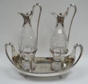 A GEORGE III SILVER CRUET SET by important makers John Wakelin & William Taylor, the two cut-glass