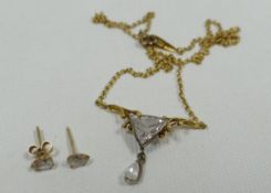 A TRILLION CUT DIAMOND PENDANT SET comprising 18ct yellow gold necklace with the main trillion-cut