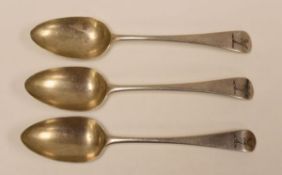 A SET OF THREE ENGLISH SILVER SERVING SPOONS with engraved deer head heraldry to the terminals,