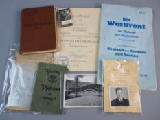 GERMAN WWI AND WWII EPHEMERA to include a field officer's passbook, a Gooring flick book,