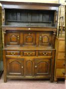 AN 18th CENTURY WELSH OAK TRIDARN, the upper section having a hood with turned pillars and part