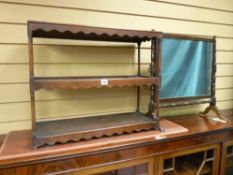 A GEORGIAN MAHOGANY THREE SHELF DISPLAY STAND with shaped apron decoration and slender turned