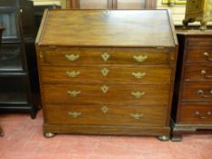 A GEORGIAN MAHOGANY BUREAU the slope front revealing a well fitted interior of seven small