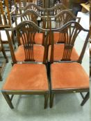A GOOD SET OF SIX COUNTRY OAK DINING CHAIRS having shaped top rails with pierced fan splatbacks,