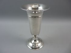 A HALLMARKED SILVER TRUMPET VASE with loaded circular base, Birmingham 1915, 17 cms high, 6 troy ozs