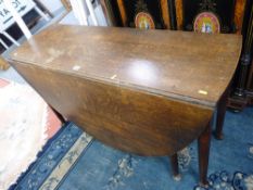 AN ANTIQUE OAK GATE LEG DINING TABLE on block and turned supports with pad feet, 70 cms high, 120