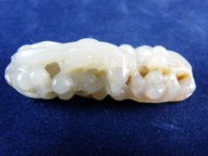 A CHINESE WHITE AND RUSSET JADE SQUIRREL AND GRAPE VINE PENDANT, 5.25 cms long