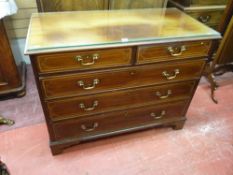 AN INLAID MAHOGANY CHEST of two short over three long drawers, pine lined with cock beaded edges and
