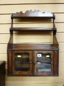 A GEORGIAN MAHOGANY WALL RACK/CABINET, the shaped top rail and sides with three open central shelves