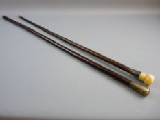 TWO VINTAGE WALKING CANES, one having a hallmarked silver top, 91 cms long, the other with an