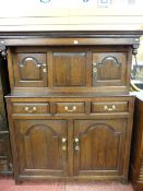 AN 18th CENTURY OAK DEUDDARN, the moulded cornice over inverted forward finials to the upper section