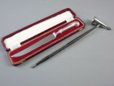 A HALLMARKED SILVER AND HORN CANDLE SNUFFER and a silver handled bread/cake knife, the candle