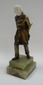 A BRONZE & IVORY FIGURE OF A STRIDING GENT, PROBABLY BY JOSEF LORENZL on a stepped green onyx